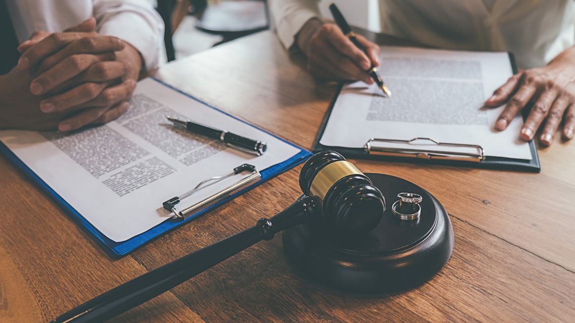 Legal documents and gavel representing a Massachusetts divorce name change process