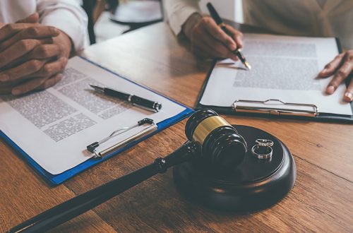 Legal documents and gavel representing a Massachusetts divorce name change process